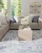 Karina 69G7F Ivory/Blue Area Rug