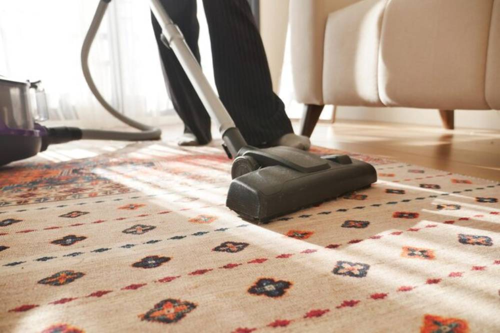 Vacuum the rug thoroughly